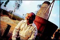 The sarpanch of Nigve Village, Suresh Patil, like most gurhal owners has his own farm, but also buys sugarcane from neighbouring farms to make gur.