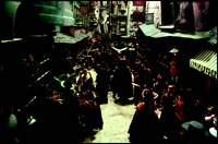 A market scene at Hogsmeade where Witches and Wizards come out to shop.