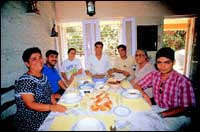 Khorshed Irani sits at the head of his table flanked by the family. To his left are son Zarathusht Ragaby, mother Gavher and neighbour Farzan Mazda. And, to his right, are daughter-in-law Fraynaz and son Dr. Yohann Ragaby, and wife Moti.