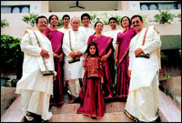 A. S. Raja and wife Dr. Mangala Gowri flanked by the children and grandchildren. Extreme left is A. Vijay Kumar and wife A. Vasumathi, their sons A. Vikas, who is an engineering student, and A. Vishal, who is studying commerce. Extreme right is Dr. A. V. Siva Prasad and wife Dr. A. Sugandhi, their son A. Sailesh, who is in the tenth standard, and daughter A. Shriya, who is in the second standard.