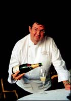 Pascal Tingaud, Chef de Cuisine at the prestigious House of Moet & Chandon, pouring himself a glass of champagne.