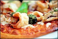 The Marinara is a woodfire-made pizza with seafood and chillies.