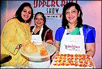 Swati Piramal lends a helping hand to Arunika and Devina Shah in their workshop on Cordon Bleu pastry-making at the Expo Centre.