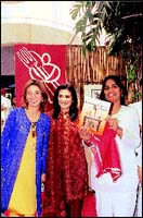 Farzana Contractor launches Asha Khataus new cookery book Vegetarian Cuisines of India while VJ-singer Raageshwari smiles on.