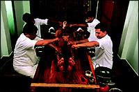 The Taj Ayurveda Centres star masseur, Vijaykumar  front, at right, leads a team in a herbal massage.
