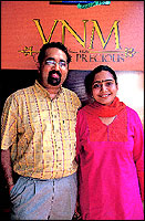Rajeev Mohandas Naik and his wife Ranjana. Their showroom is a glitzy building in Calicut.