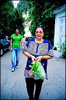 Mama Abraham does the bazaar with vegetable vendors just outside their building in Bandra.