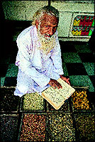 Hakim Hafiz Salim, at 85, is the grand old man of Unani medicine in Aurangabad. Here he is referring to a Unani medicine book that 
is older than himself!