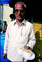 Keshavrao Amrutrao Bhunge offers a cup of his famous Golden Tea for Rs. 4.