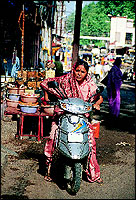 The two-wheeler is the most common and comfortable means of transport for the housewife to go to the market on.