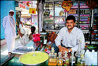 Mir Azhar Ali with his little perfumery at Attar Galli in City Chowk. He also sells mehendi and murabas and other Unani medicines.