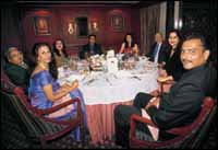 A table of seven waits for Anton Mosimanns grand finale, the Bread and Butter Pudding. From left, Shobha De, the author, Behram Contractor, Nina Pillai, Dilip De, Sharon Prabhakar, Asit Chandmal, Zeenat Aman, and Ravi Shastri.