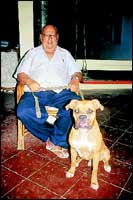 In the evening, he retires to sit at home with the dog.