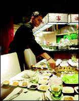 The Korean tables have the barbecue in-built and are especially designed to grill seafood and meat and have it with kimchi, sticky rice and dipping sauces.