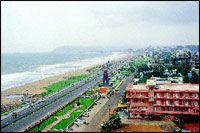 From the terrace of their penthouse apartment, Lancy, daughter Lynette and wife Lulu Gomes can see all down R. K. Beach Road to the Dolphins Nose in the distance.
