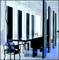 One of the dining areas 
with high-backed chairs.