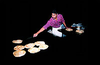 Making the Malabar paratha is an art. It is made out of rice flour in layers, and pan-fried. At the end, the man making it crumbles it up like a handkerchief.