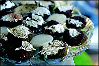 The Surti Shikampur Kebab, which is like a Shammi Kebab, and covered with varq.