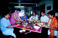 Shilpa serves the family during lunch.