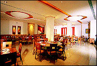 A Mainland China anywhere will look the same. It will have respectable elbow room, comfortable seating, the sofas and chairs, the table mats, will all look of place, the crockery and cutlery will be savvy but not swank. Every restaurant will even have a Moon Gate entry to it like the one at right to the new Mainland China at Andheri west in Bombay.