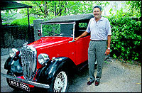 Rumi and Dilshad Printer with his vintage Austin.