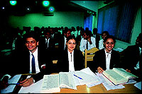 Students in a classroom and, above, in the state-of-the-art auditorium.