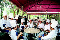 A break from studies becomes an occasion for a group discussion in the students cafeteria.