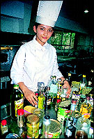 Young girl students go through a class in the kitchen in their training to become future chefs some day.