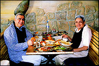 The legendary Behram Contractor in his avatar as restaurant reviewer Busybee doing an Eating Out column on Trishna in Bombay with celebrated film-maker Ismail merchant as his guest for the UpperCrust.