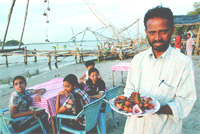 The Taj Ayurveda Centres star masseur, Vijaykumar  front, at right, leads a team in a herbal massage.